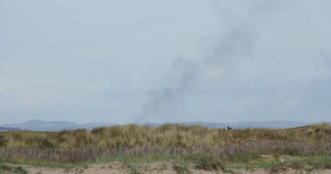 Distant smoke from a fire over the new course at Saint Andrews 動画素材 320166039