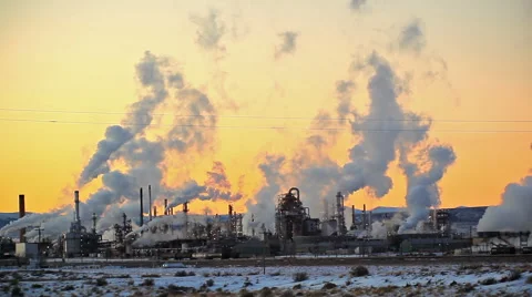 Distant Smoke Stacks during Sunset Stock Footage 52454087