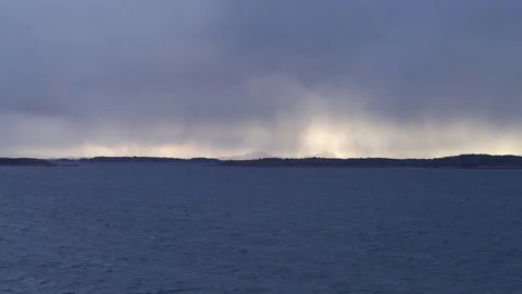Distant storm on fjord Stock Footage 73246937