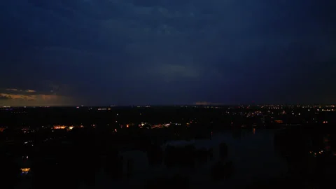 A Distant Thunder and Lightning Storm Raging In The Evening Sky Over Downtown Stock-Footage 316316960