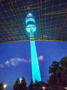 Distant Tower Illuminated at Night 스톡 사진