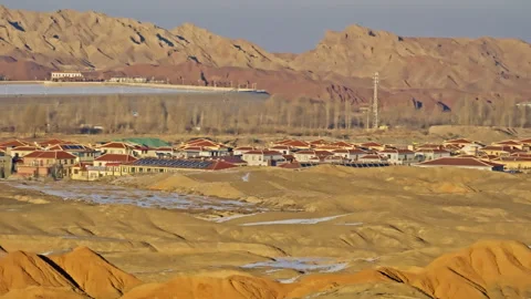 Distant Town in Snowy Danxia Mountains Sunset B-Roll Stock Footage 325866140