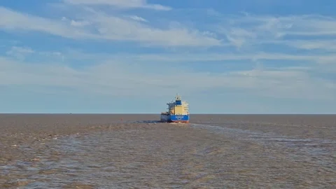 Distant tracking video shot showing the stern view of a large vessel Video stock 347032828