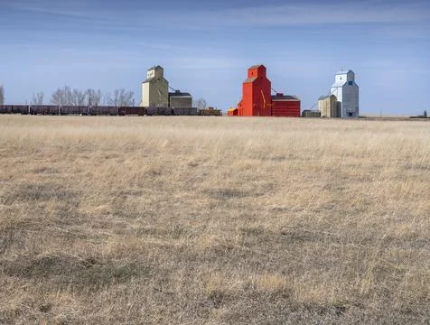 Distant Train and Grain Elevators Stock Photos
