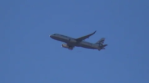 Distant view of an aircraft during flight of AEGEAN company Stock Footage 127608647