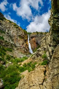 Distant view of Apikuni Falls at Glacier National Park Montana Stock Photos