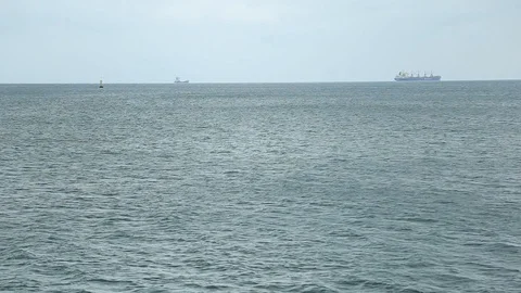 Distant view at big cargo ship floating in open seas. Calm sea, industrial 스톡 동영상 105273323