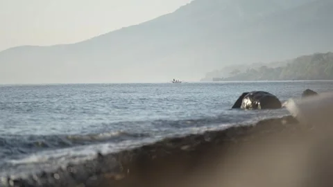 A distant view of the boat that will pull over to the coast. foggy sea view. Stock Footage 255998328