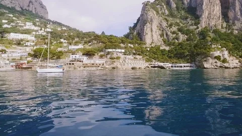 Distant view of coastline homes panning. On board perspective shooting. Scenic Stock Footage 108729335