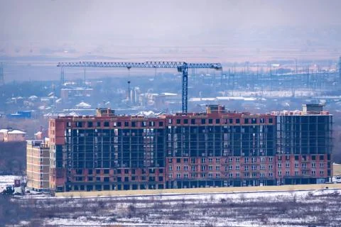Distant view of a construction site with new buildings in winter Foto stock