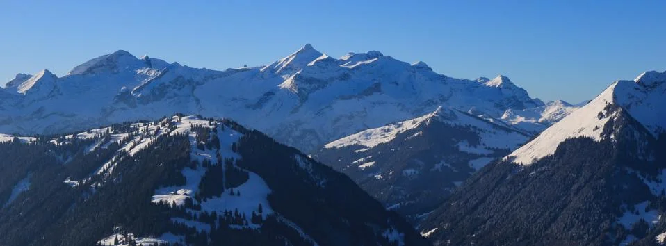 Distant view of the Diablerets mountain range in winter. Stock Photos