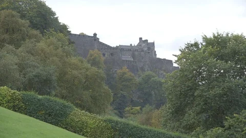 Distant view of Edinburgh Castle with greenery in foreground Stock Footage 74166291