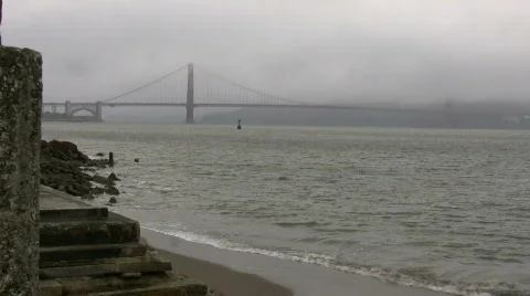 Distant view of the Golden Gate Bridge on foggy day Stock Footage 367856