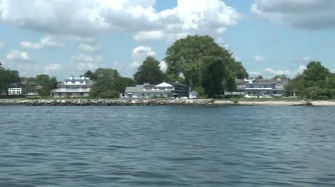 Distant view of homes on the water. Stock Footage 8982314
