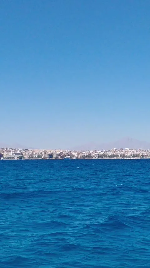 Distant view of Hurghada resort coastline skyline from Red Sea in Egypt 스톡 동영상 341290094