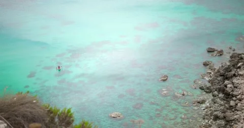 Distant View Of Kayakers In Clear Blue Ocean Stock Footage 157675937