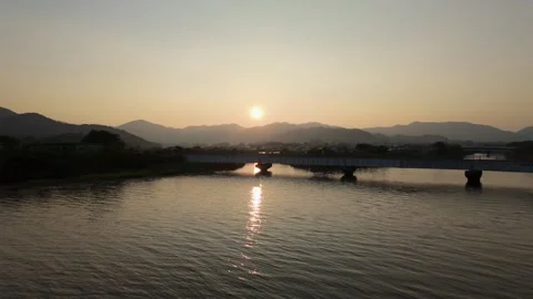 Distant View of Lake Hamana Shore with Sunset and Bridge Stock Footage 340414071