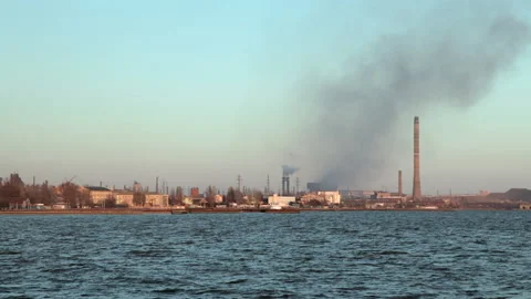 A distant view of the large Azovstal foundry with smoking pipes. Ecological Stock Footage 183545204