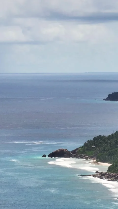Distant view of Mahes granite coastline. Stock Footage 324847097