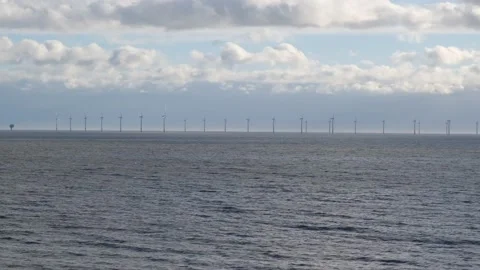Distant view of offshore wind farm turbines. Essex coast Stock Footage 173480993