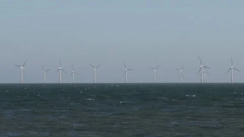 Distant view of offshore wind farm turbines. Gunfleet sands. Coast of Essex Stock Footage 173483144