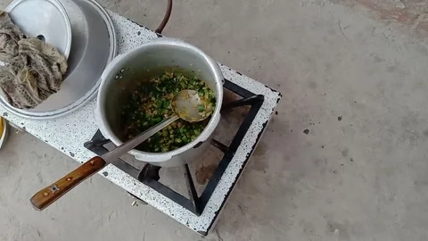Distant View of Okra Vegetable Cooking in a Pakistani Kitchen Stock-Footage 347341514