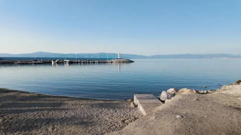 Distant view of a pier on a beautiful day Stock Footage 310945113