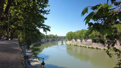 A distant view of the Ponte Sisto across the river Tiber in Rome on a spring day Stock Footage 154682624