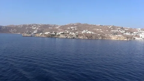 Distant View of a Rocky Island with White Houses Stock Footage 70732684