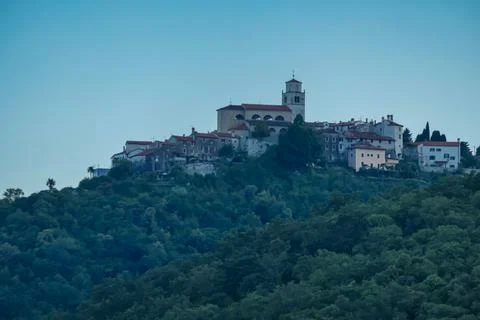 A distant view on a small town located at the top of the hill in Moscenicka.. Stock Photos