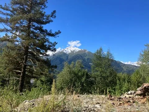 Distant view of snow-capped Caucasus mountains, Ushguli, Georgia Stock Photos