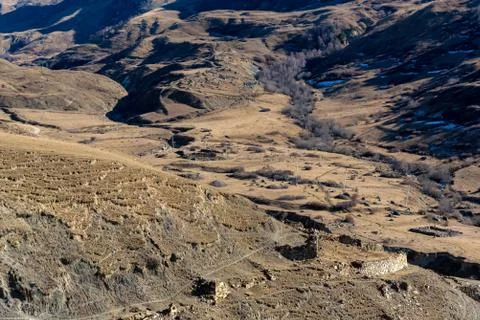Distant view stone remains of old abandoned balkar village in North Caucasus Stock Photos