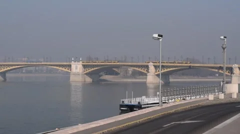 Distant View of Trams Crossing the Margaret Bridge in Budapest, Hungary Stock Footage 47710742