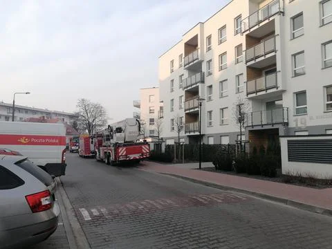 Distant view of trucks in row parked by apartment building in the Stare Zegrze d Fotos de archivo