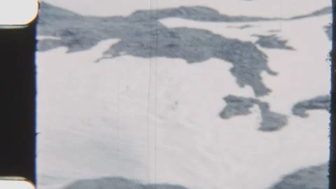Distant View Of Two Ice Skaters Gliding On Snowy Landscape Stock Footage 322132464