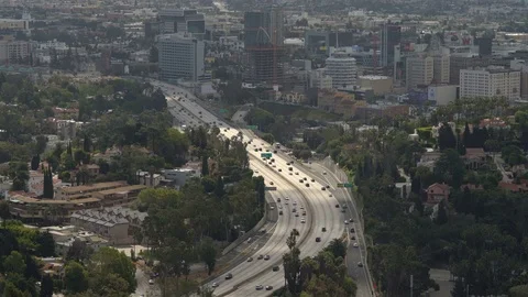 Distant View: Urban Highway Freeway Through the City Stock Footage 75970169