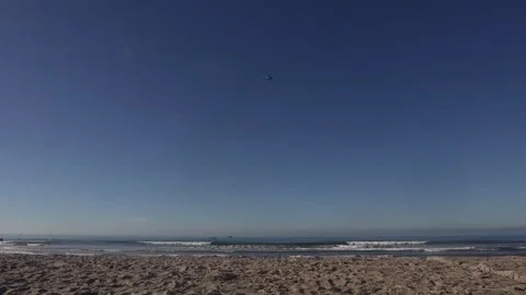 Distant view of U.S. Marines MV-22 Osprey flying over ocean Stock Footage 272907673