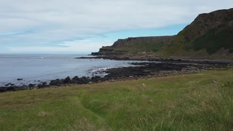 Distant View of Visitors Exploring the Giant’s Causeway, Northern Ireland Stock Footage 307212651