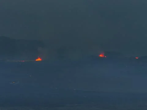 Distant View of Volcanic Eruption with Bright Orange Flames in Iceland Stock Photos
