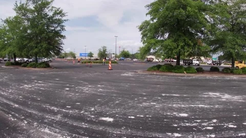 Distant view Walmart parking lot being paved Stock Footage 153563655