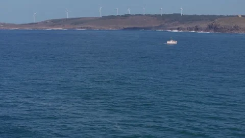 Distant View Of Wind Farm Of Muxia Across The Ocean Stock Footage 269910657