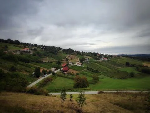 Distant Village Under Dark Cloudy Sky 写真素材