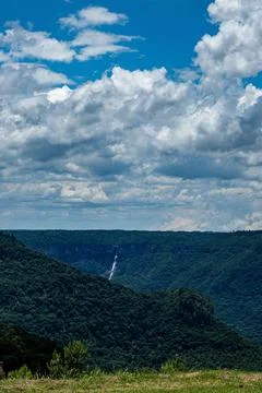 Distant waterfall composing the magnificent landscape Stock Photos