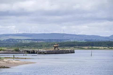 Distant wind turbines dot the rolling hills Stock Photos