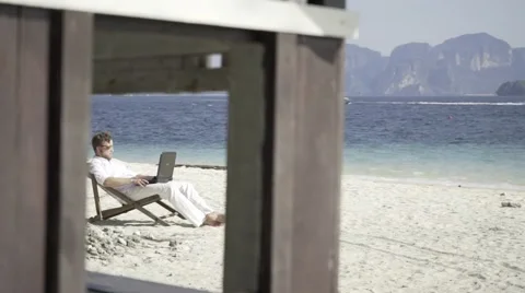 Distant work on the beautiful beach. Stock Footage 60781339