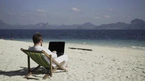 Distant work on the beautiful beach. Stock Footage 60781396