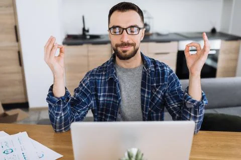 Distant work man business freelancer home caucasian student meditation Stock-Fotos