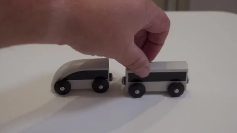 Distinct Click of Connection as Two Magnetic Wooden Toy Train Cars Join 스톡 동영상 321268068
