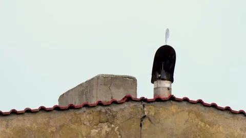 Distinctive Chimney Structure Atop Weathered Building. Rotary turbine, Stock Footage 303378233