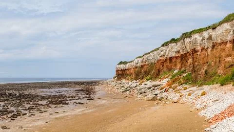 Distinctive striped cliffs at Old Hunstanton Stock Photos